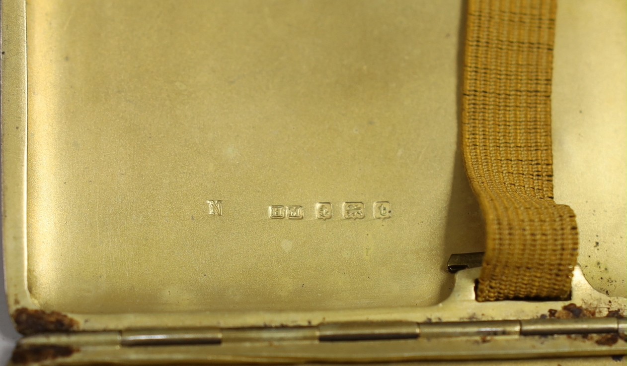 An Edwardian silver trinket box, Birmingham, 1907, 90mm, a silver cigarette case and a Persian? white metal oval box.